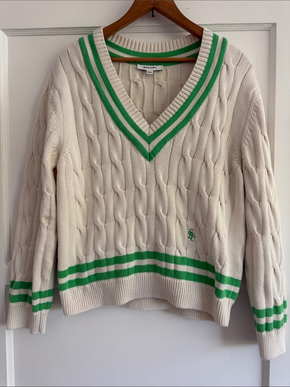 Sporty & Rich Cream Cable-Knit V-Neck Sweater with Green Stripe Detail